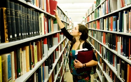 student in library